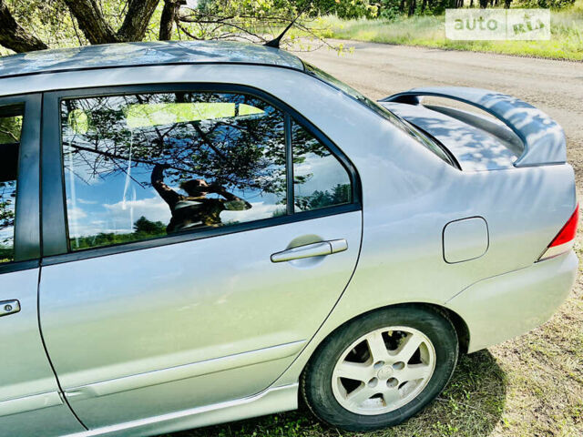 Сірий Міцубісі Lancer, об'ємом двигуна 1.6 л та пробігом 203 тис. км за 5000 $, фото 7 на Automoto.ua