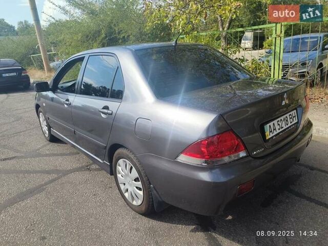 Сірий Міцубісі Lancer, об'ємом двигуна 1.6 л та пробігом 242 тис. км за 4900 $, фото 10 на Automoto.ua