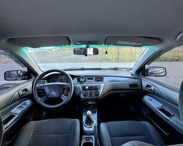 Мицубиси Лансер 2006 в Черновцах на Automoto.ua Серый Мицубиси Лансер, объемом двигателя 1.6 л и пробегом 299 тыс. км за 4300 $, фото 9 на Automoto.ua