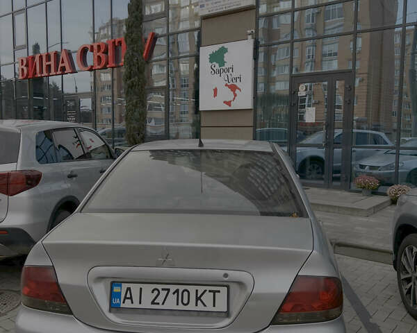 Серый Мицубиси Лансер, объемом двигателя 1.6 л и пробегом 310 тыс. км за 3500 $, фото 2 на Automoto.ua