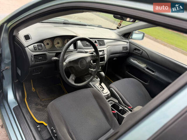 Серый Мицубиси Лансер, объемом двигателя 1.58 л и пробегом 260 тыс. км за 4050 $, фото 8 на Automoto.ua