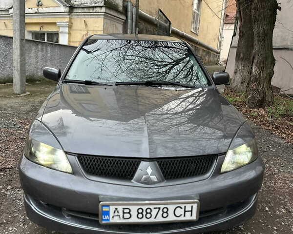 Сірий Міцубісі Lancer, об'ємом двигуна 2 л та пробігом 200 тис. км за 4999 $, фото 4 на Automoto.ua