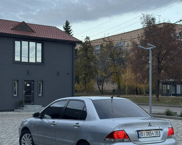 Серый Мицубиси Лансер, объемом двигателя 1.6 л и пробегом 269 тыс. км за 4000 $, фото 3 на Automoto.ua