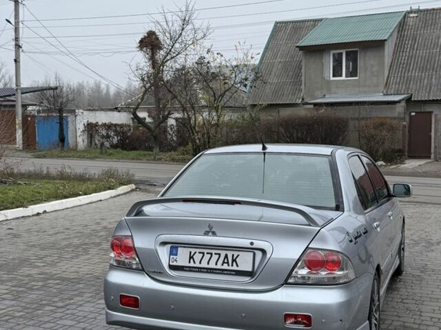 Серый Мицубиси Лансер, объемом двигателя 2 л и пробегом 256 тыс. км за 7000 $, фото 6 на Automoto.ua