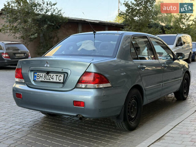 Сірий Міцубісі Lancer, об'ємом двигуна 1.6 л та пробігом 152 тис. км за 3800 $, фото 5 на Automoto.ua