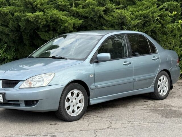 Серый Мицубиси Лансер, объемом двигателя 1.6 л и пробегом 220 тыс. км за 4400 $, фото 2 на Automoto.ua