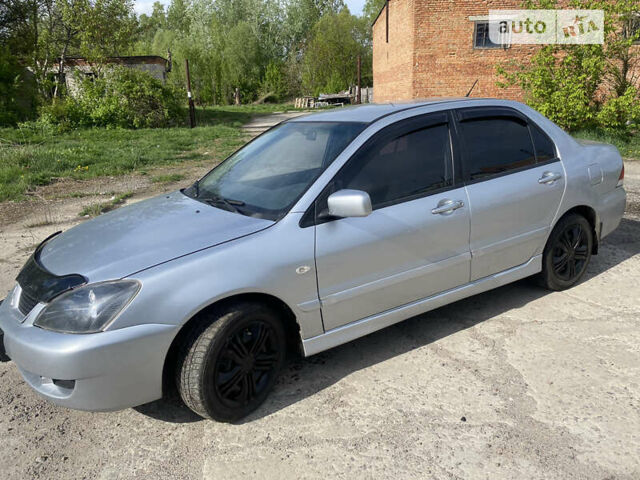 Сірий Міцубісі Lancer, об'ємом двигуна 1.58 л та пробігом 211 тис. км за 3999 $, фото 4 на Automoto.ua