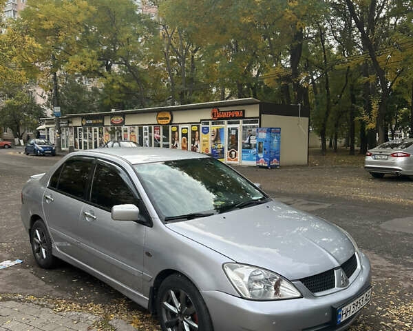 Серый Мицубиси Лансер, объемом двигателя 1.58 л и пробегом 244 тыс. км за 4950 $, фото 16 на Automoto.ua