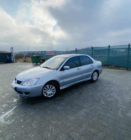 Серый Мицубиси Лансер, объемом двигателя 1.6 л и пробегом 253 тыс. км за 2850 $, фото 4 на Automoto.ua