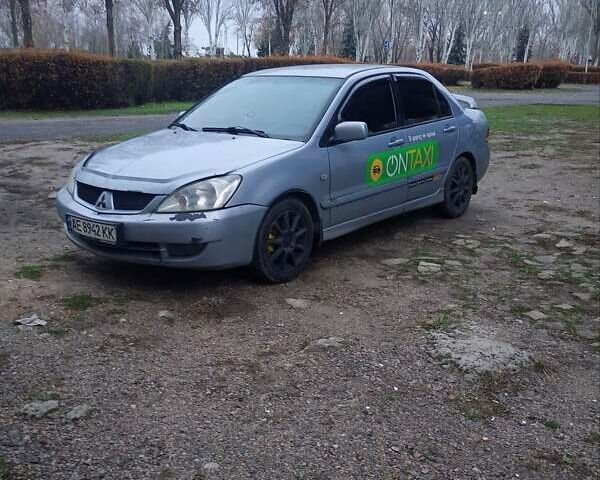Сірий Міцубісі Lancer, об'ємом двигуна 1.58 л та пробігом 264 тис. км за 3200 $, фото 2 на Automoto.ua