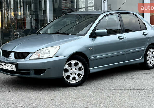 Сірий Міцубісі Lancer, об'ємом двигуна 1.58 л та пробігом 275 тис. км за 4600 $, фото 10 на Automoto.ua