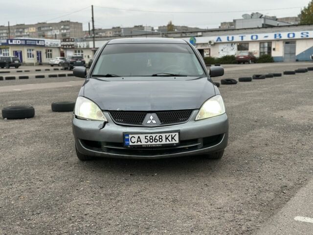 Серый Мицубиси Лансер, объемом двигателя 1.6 л и пробегом 250 тыс. км за 2550 $, фото 1 на Automoto.ua