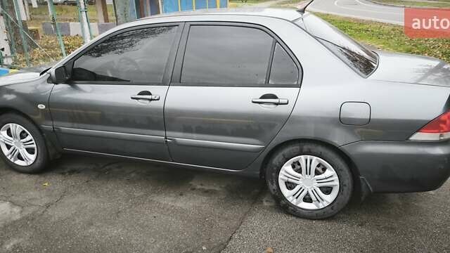 Серый Мицубиси Лансер, объемом двигателя 1.6 л и пробегом 263 тыс. км за 3800 $, фото 3 на Automoto.ua