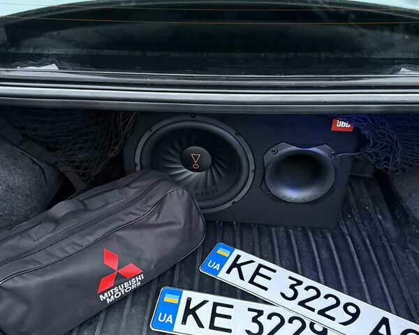 Серый Мицубиси Лансер, объемом двигателя 2 л и пробегом 256 тыс. км за 7000 $, фото 5 на Automoto.ua