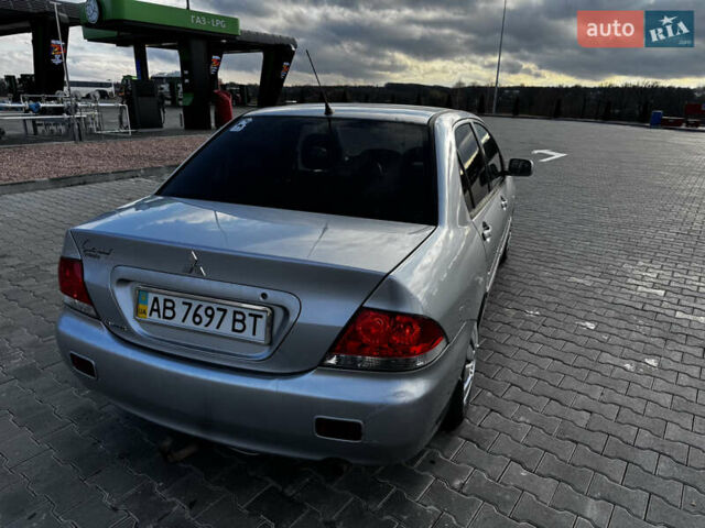 Сірий Міцубісі Lancer, об'ємом двигуна 1.58 л та пробігом 333 тис. км за 2700 $, фото 7 на Automoto.ua