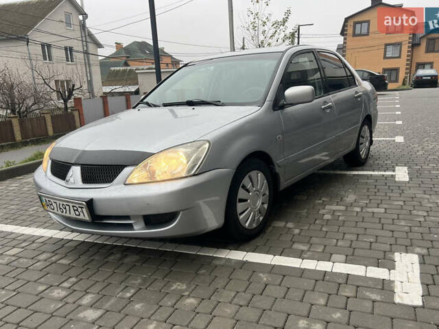 Сірий Міцубісі Lancer, об'ємом двигуна 1.58 л та пробігом 333 тис. км за 2450 $, фото 1 на Automoto.ua