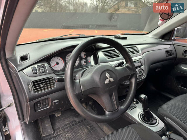 Серый Мицубиси Лансер, объемом двигателя 1.6 л и пробегом 242 тыс. км за 4300 $, фото 7 на Automoto.ua