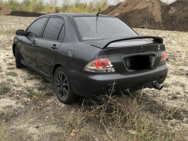 Міцубісі Lancer 2006 у Синельниковом на Automoto.ua Сірий Міцубісі Lancer, об'ємом двигуна 2 л та пробігом 200 тис. км за 3000 $, фото 1 на Automoto.ua
