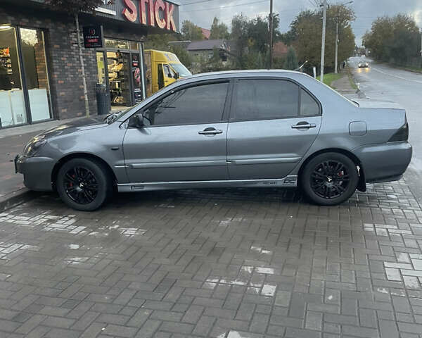 Сірий Міцубісі Lancer, об'ємом двигуна 1.6 л та пробігом 244 тис. км за 2999 $, фото 7 на Automoto.ua