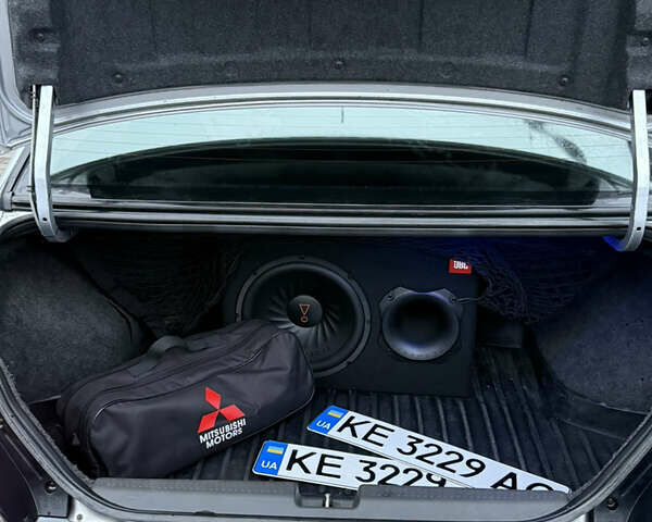 Серый Мицубиси Лансер, объемом двигателя 2 л и пробегом 256 тыс. км за 7000 $, фото 6 на Automoto.ua