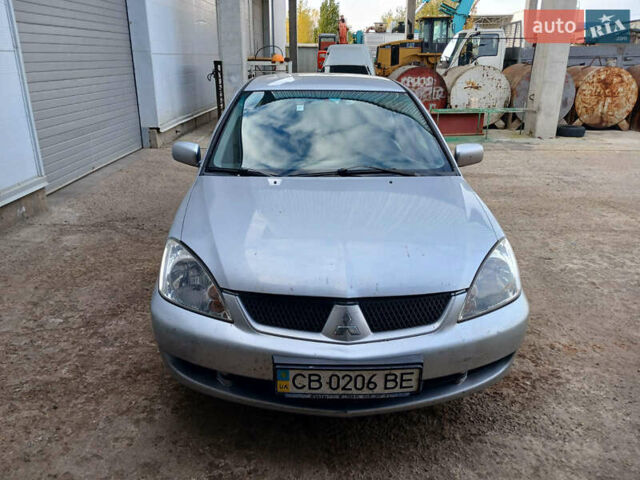Серый Мицубиси Лансер, объемом двигателя 1.58 л и пробегом 215 тыс. км за 4000 $, фото 2 на Automoto.ua