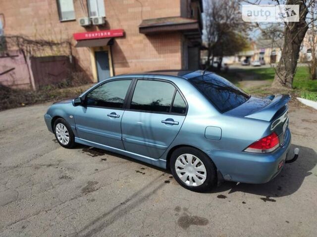 Сірий Міцубісі Lancer, об'ємом двигуна 1.6 л та пробігом 212 тис. км за 4700 $, фото 7 на Automoto.ua