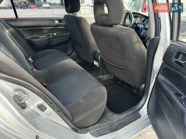 Серый Мицубиси Лансер, объемом двигателя 1.6 л и пробегом 333 тыс. км за 2600 $, фото 15 на Automoto.ua