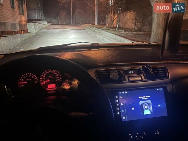 Сірий Міцубісі Lancer, об'ємом двигуна 1.58 л та пробігом 197 тис. км за 3450 $, фото 12 на Automoto.ua