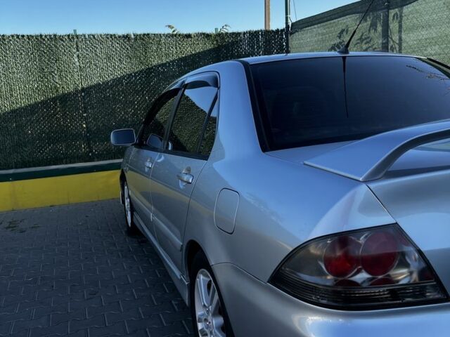 Сірий Міцубісі Lancer, об'ємом двигуна 2 л та пробігом 192 тис. км за 5400 $, фото 5 на Automoto.ua
