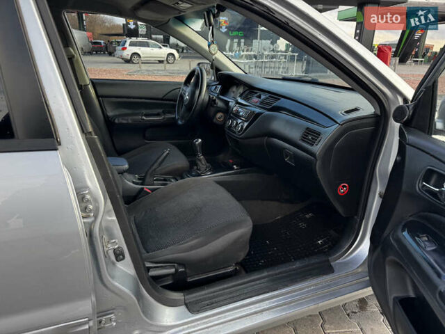 Сірий Міцубісі Lancer, об'ємом двигуна 1.58 л та пробігом 333 тис. км за 2700 $, фото 11 на Automoto.ua