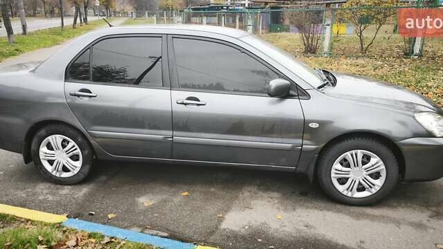 Серый Мицубиси Лансер, объемом двигателя 1.6 л и пробегом 263 тыс. км за 3800 $, фото 9 на Automoto.ua