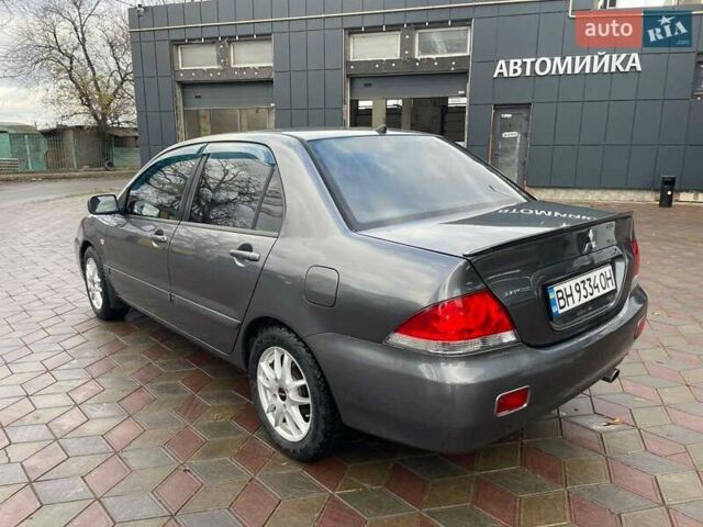 Сірий Міцубісі Lancer, об'ємом двигуна 1.6 л та пробігом 262 тис. км за 4400 $, фото 5 на Automoto.ua