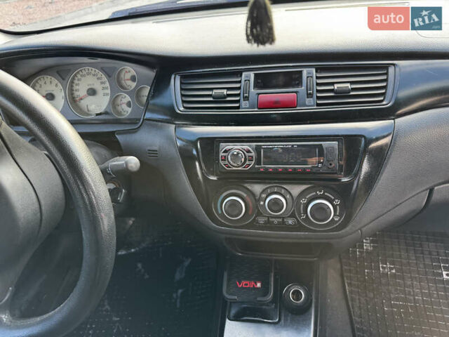 Сірий Міцубісі Lancer, об'ємом двигуна 1.58 л та пробігом 333 тис. км за 2999 $, фото 11 на Automoto.ua