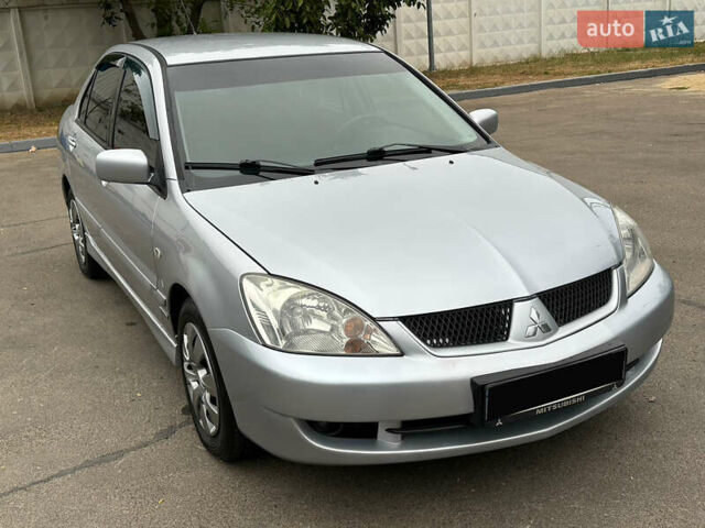 Серый Мицубиси Лансер, объемом двигателя 1.58 л и пробегом 183 тыс. км за 4800 $, фото 18 на Automoto.ua