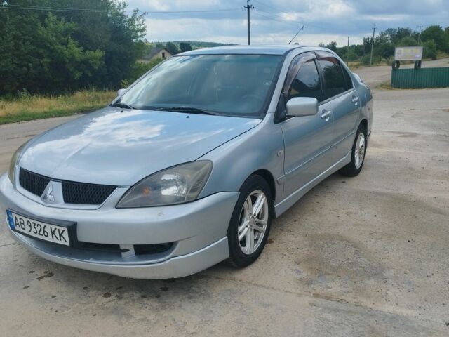 Серый Мицубиси Лансер, объемом двигателя 2 л и пробегом 306 тыс. км за 4100 $, фото 7 на Automoto.ua