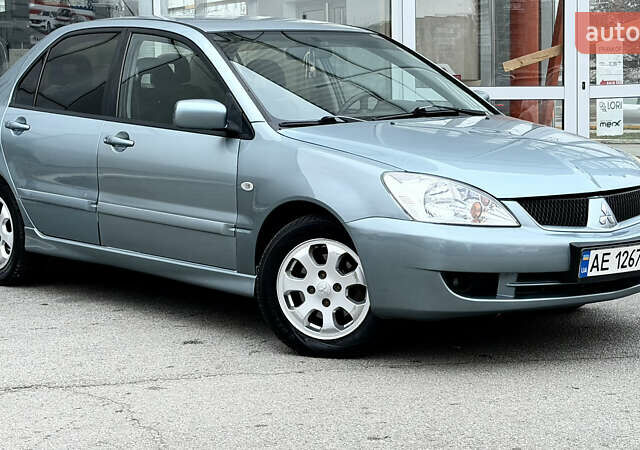 Сірий Міцубісі Lancer, об'ємом двигуна 1.58 л та пробігом 275 тис. км за 4600 $, фото 8 на Automoto.ua