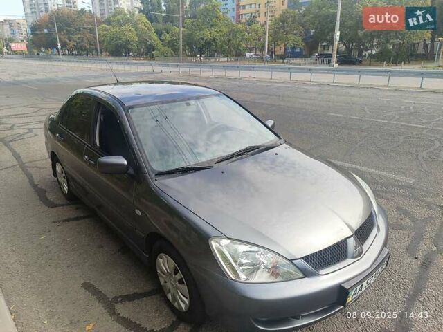 Сірий Міцубісі Lancer, об'ємом двигуна 1.6 л та пробігом 242 тис. км за 4900 $, фото 3 на Automoto.ua