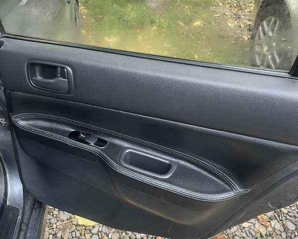 Сірий Міцубісі Lancer, об'ємом двигуна 1.6 л та пробігом 244 тис. км за 2999 $, фото 19 на Automoto.ua