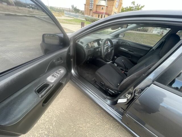 Серый Мицубиси Лансер, объемом двигателя 1.6 л и пробегом 162 тыс. км за 4650 $, фото 4 на Automoto.ua