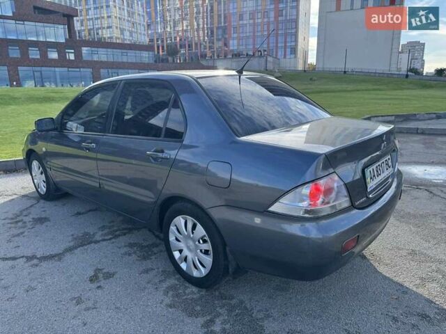 Сірий Міцубісі Lancer, об'ємом двигуна 1.58 л та пробігом 276 тис. км за 3650 $, фото 7 на Automoto.ua