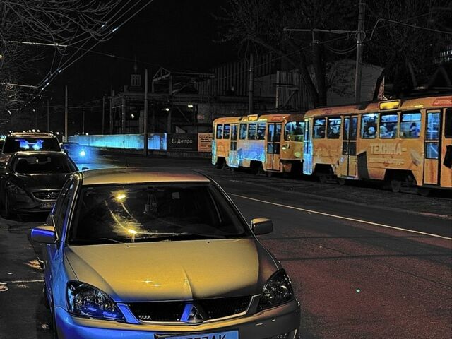 Серый Мицубиси Лансер, объемом двигателя 2 л и пробегом 256 тыс. км за 7000 $, фото 12 на Automoto.ua