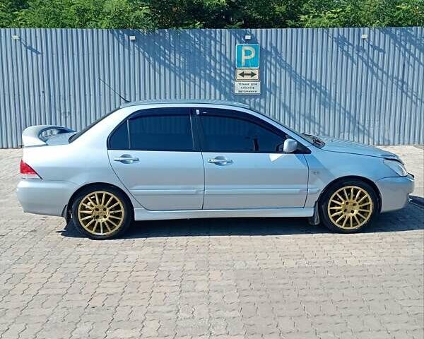 Сірий Міцубісі Lancer, об'ємом двигуна 1.58 л та пробігом 265 тис. км за 2900 $, фото 2 на Automoto.ua