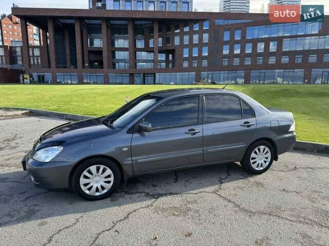 Сірий Міцубісі Lancer, об'ємом двигуна 1.58 л та пробігом 276 тис. км за 3650 $, фото 3 на Automoto.ua