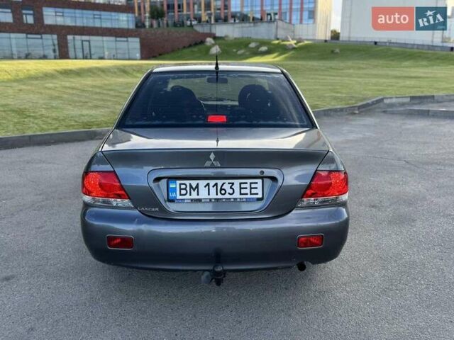 Сірий Міцубісі Lancer, об'ємом двигуна 1.58 л та пробігом 267 тис. км за 3999 $, фото 2 на Automoto.ua