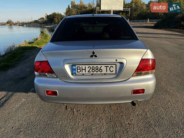 Серый Мицубиси Лансер, объемом двигателя 1.58 л и пробегом 190 тыс. км за 4600 $, фото 6 на Automoto.ua