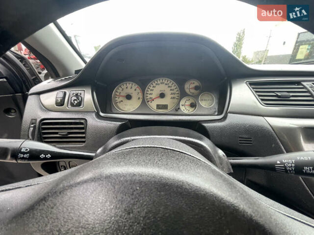 Сірий Міцубісі Lancer, об'ємом двигуна 1.58 л та пробігом 162 тис. км за 4650 $, фото 17 на Automoto.ua