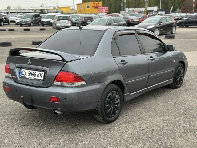 Серый Мицубиси Лансер, объемом двигателя 1.6 л и пробегом 250 тыс. км за 2550 $, фото 3 на Automoto.ua