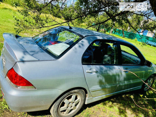 Сірий Міцубісі Lancer, об'ємом двигуна 1.6 л та пробігом 203 тис. км за 5000 $, фото 6 на Automoto.ua