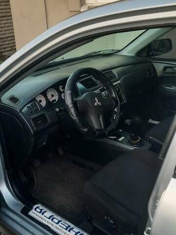 Сірий Міцубісі Lancer, об'ємом двигуна 1.58 л та пробігом 238 тис. км за 5000 $, фото 10 на Automoto.ua