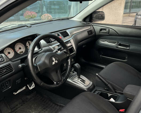 Серый Мицубиси Лансер, объемом двигателя 1.6 л и пробегом 310 тыс. км за 3500 $, фото 7 на Automoto.ua